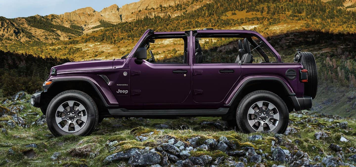 Display A side profile of the 2023 Jeep Wrangler Overland with its top off.